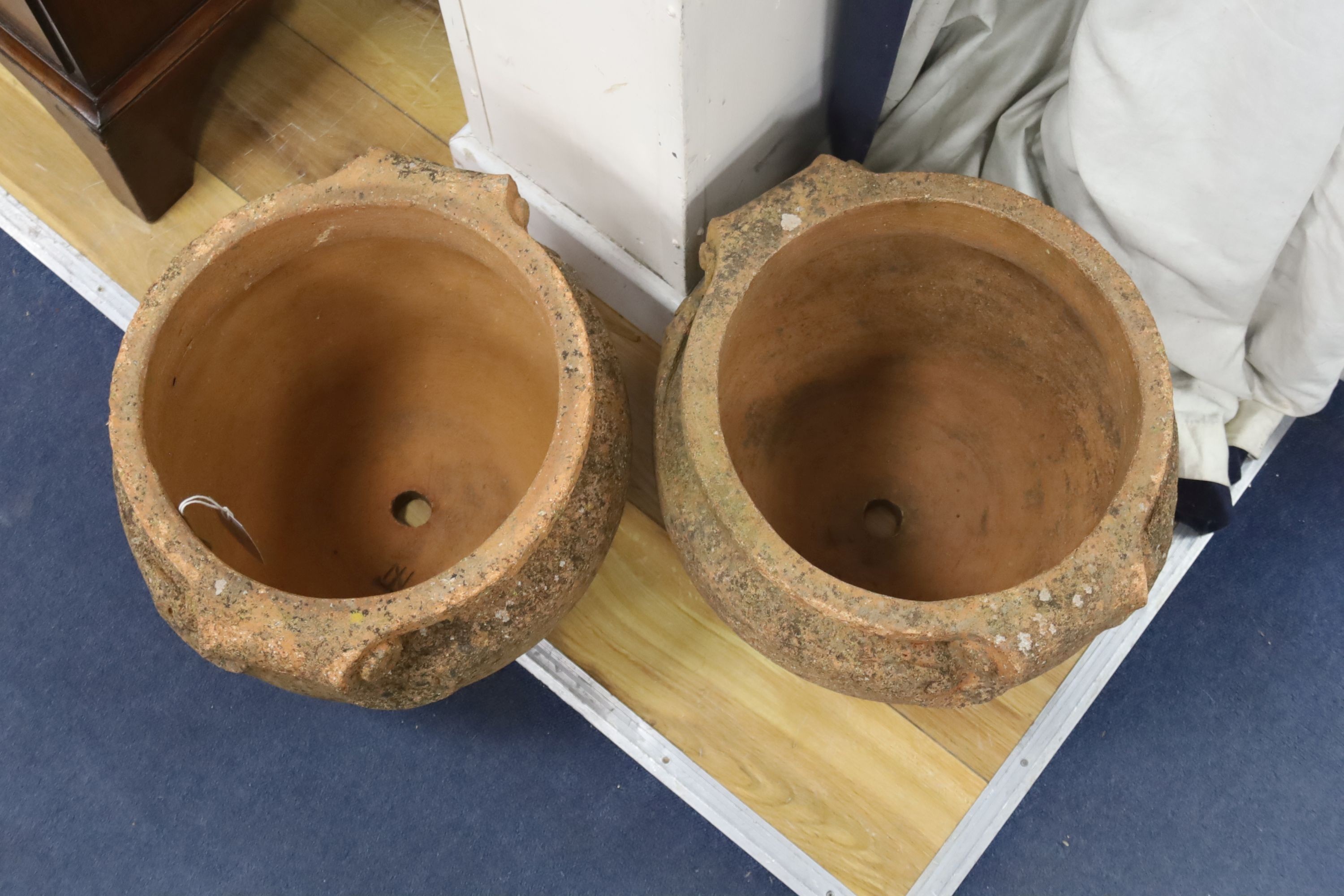 A pair of Compton terracotta garden urns, diameter 36cm, height 30cm